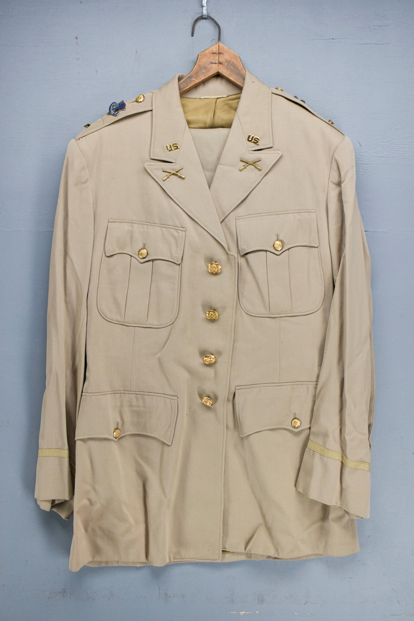 U.S. Army Khaki Uniform, 361st Regiment BCT: U.S. Army khaki uniform with a jacket with matching trousers. Unit insignia attached.