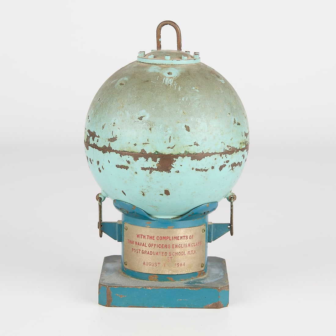 Vintage Commemorative Thai Naval Mine Display: Vintage naval mine or other ordinance mounted on display stand and inscribed with message from Thai Naval Officers, 1964.8"H x 5"W x 5"D.