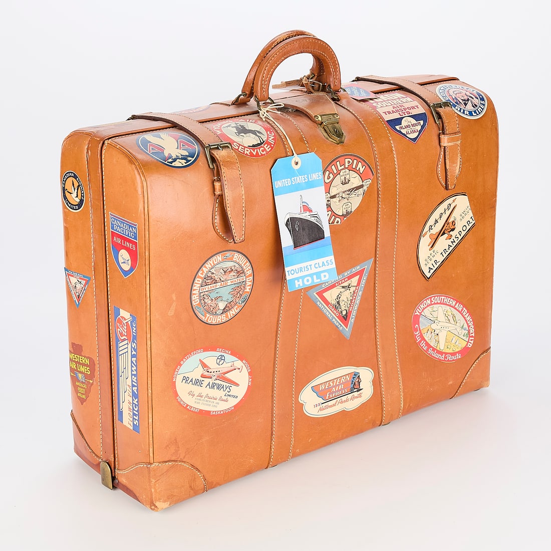 Vintage 1950s Thiss Suitcase W/ Railroad and Travel Decals: Leather suitcase with travel stickers and decals throughout the exterior. Made by Thiss Luggage. Monogrammed CFB on top. 18.5"H x 23.5"L x 8.5"W.