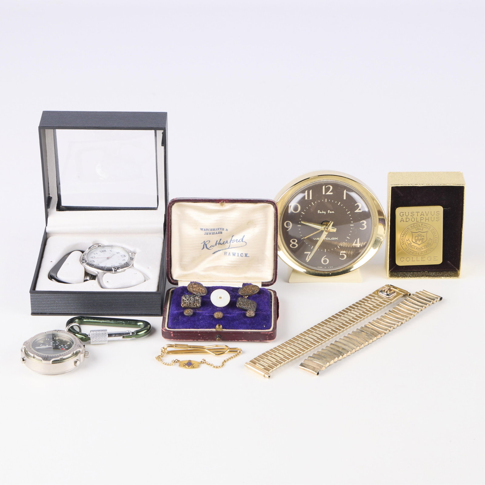 Group Men's Accessories, Speidel Westclox Etc.: Group of men's accessories, including:One gold filled Speidel expandable watch strap with Dayton's logo.One Champion expandable watch strap.One Gustavus Adolphus gold tone money clip.One gold filled M