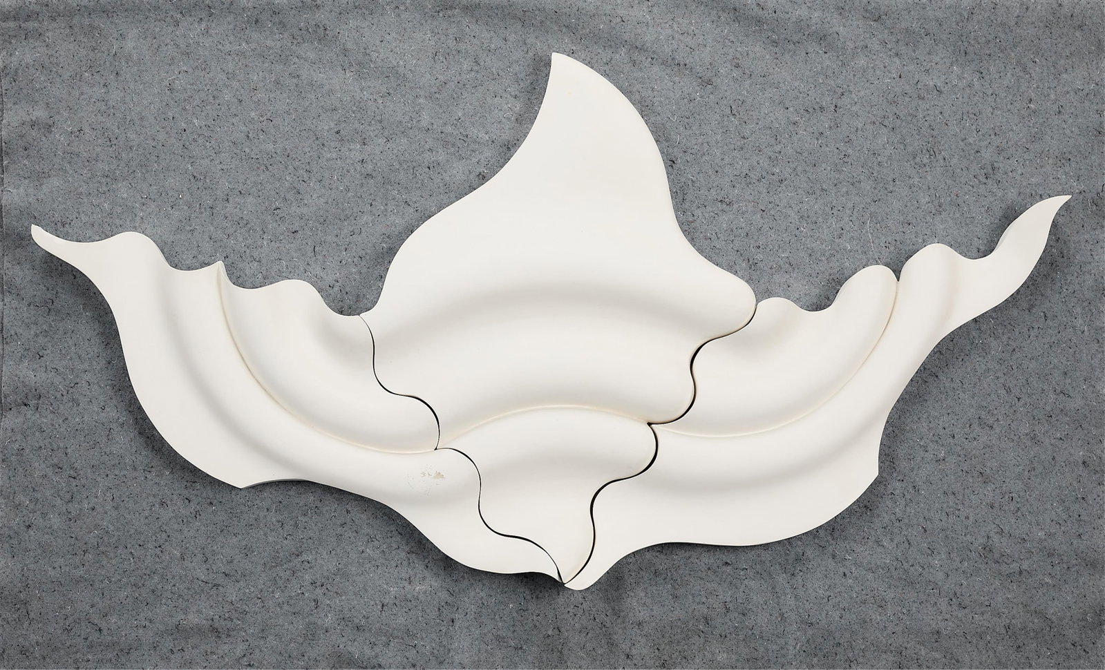 Ann Preston "In His Image" Constituent Tiles: Plaster, hydrocal, and sealant hanging abstract wall sculpture. 1988. (Assembled) Height: 32 in x width: 62 in x depth: 4 in.