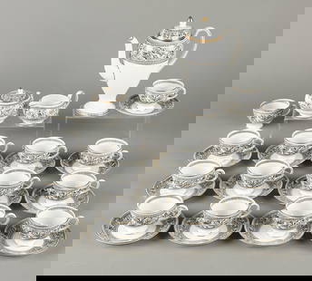 30 Pc Wedgwood Florentine Porcelain Black Tea Set: Wedgwood, United Kingdom. Set of 30 porcelain tea dishware in pattern "Florentine." Includes tall teapot, creamer, sugar bowl, 14 teacups, and 13 saucers. All decorated with intricate black detailing