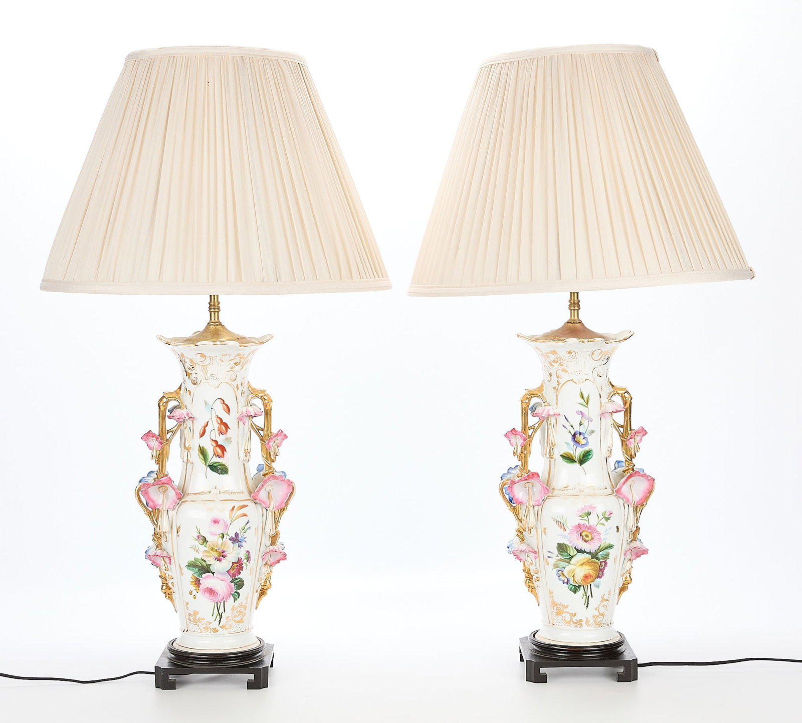 Pair Old Paris Porcelain Lamps: Pair of old Paris porcelain urns as lamps. Decorated with profuse floral decoration. Base; height: 33 in x width: 6 in x depth: 6 in. Shade; height: 13 in x diameter: 18 in.
