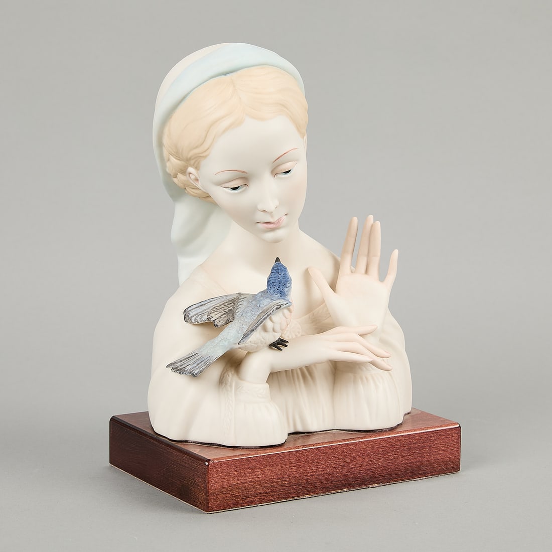 Cybis Porcelain Madonna with Blue Bird: Cybis porcelain "Madonna with Blue Bird" sculpture, depicting the Virgin Mary with a small, blue bird perched on her hand. Design was first introduced in 1956. Handpainted maker's mark along the verso