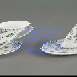 Royal Copenhagen Porcelain Teacup w/ Saucer: Royal Copenhagen porcelain teacup with matching saucer. Marked along the underside.CUP: 2"H x 3"W x 2 1/4"D. SAUCER: 4 1/2"Dia.