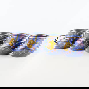 MacKenzie Childs Flower Mart Mugs, Blue, Set of 4: Heavy-gauge, hand-glazed steel underbody embellished with hand-applied floral transfers, rimmed in bronzed stainless steel. Pieces may vary due to the handmade nature of each product.4.25" dia., 3.5"