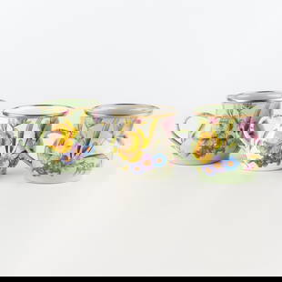 MacKenzie-Childs Flower Mart Mugs, Group of 3, Green, White: Heavy-gauge, hand-glazed steel underbody embellished with hand-applied floral transfers, rimmed in bronzed stainless steel. Pieces may vary due to the handmade nature of each product.4.25" dia., 3.5"
