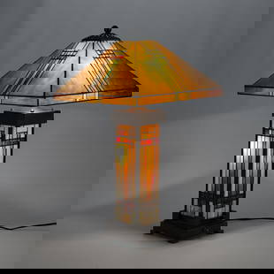 Craftsman Tiffany Style Stained Glass Lamp: Craftsman, Arts & Crafts, or Tiffany style stained or slag glass table lamp. Geometric designs.Base; height: 22 1/2 in x width: 7 1/2 in x depth: 6 1/2 in. Shade; height: 8 in x width: 15 1/2 in x dep