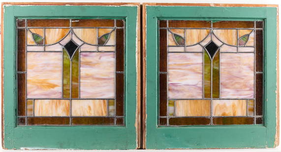 Pair Arts & Crafts Stained Glass Windows: Pair of Arts & Crafts or Art Nouveau slag stained glass windows. With geometric motifs in pale pink, green, amber, and tan. With painted green wood frames.Each, height: 21 in x width: 20 in x depth: 1