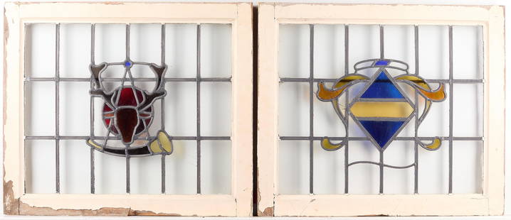Set 2 Arts & Crafts Stained Glass Windows: Set of two Arts & Crafts or Art Nouveau slag stained glass windows. One with stag and horn; the second with geometric motif. Wooden frame. (Each) Height: 23 in x width: 27 1/2 in x depth: 2 in.