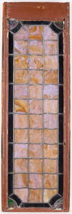 American Arts & Crafts Stained Glass Window: Arts & Crafts or Art Nouveau slag stained glass window with geometric motifs. Opaque patterned glass with violet and pale brown slag glass. Wooden frame. Height: 38 1/2 in x width: 12 1/2 in x depth: