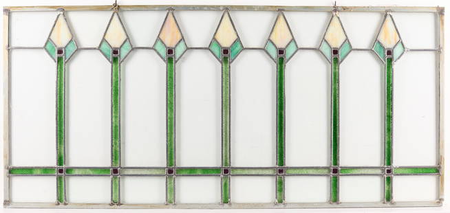 Arts & Crafts Stained Glass Window: Arts & Crafts or Art Deco slag stained glass window. With clear glass and arrow-like motifs in green and cream. Height: 18 1/2 in x width: 48 1/2 in x depth: 1/4 in.