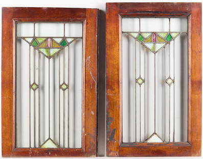 2 Small Arts & Crafts Stained Glass Windows: Pair of two small Arts & Crafts or Art Deco slag stained glass windows. Clear, pink, and green glass.Each approx., height: 23 in x width: 14 1/4 in x depth: 1 in.