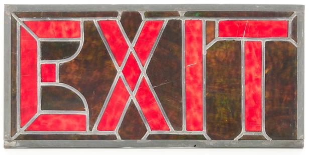 Small Arts & Crafts Stained Glass Exit Sign: Small Arts & Crafts slag stained glass exit sign. Green and red glass. Metal frame.Height: 7 1/2 in x width: 15 3/4 in x depth: 1/4 in.