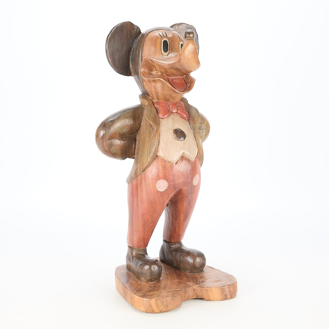 Carved Wood Mickey Mouse Sculpture: Carved wooden polychrome sculpture of Mickey Mouse. Height: 20 in x width: 10 1/2 in x depth: 7 1/2 in.