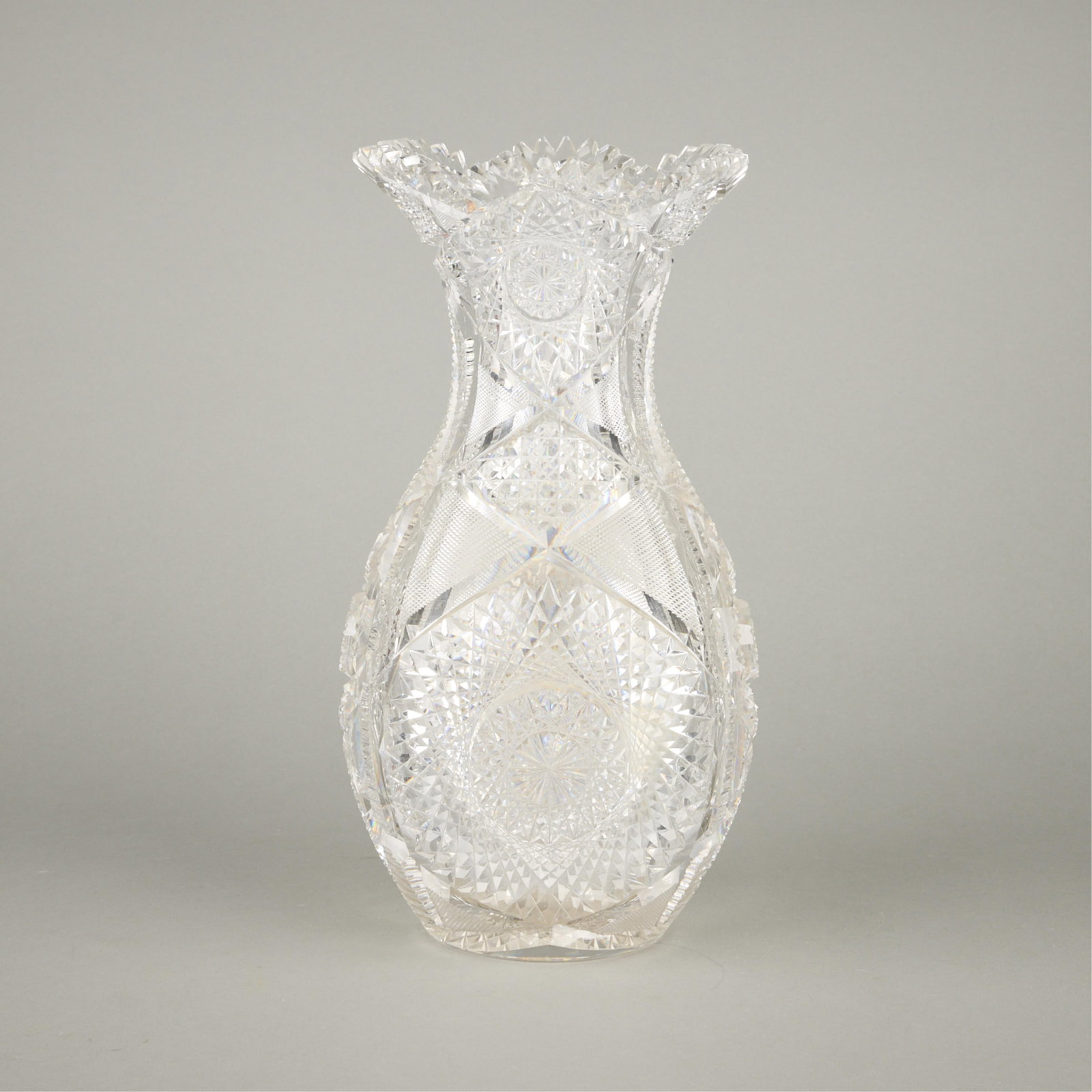Large Cut Glass Crystal Vase: Large and ornately cut crystal or glass vase.Height: 14 in x diameter: 7 in.