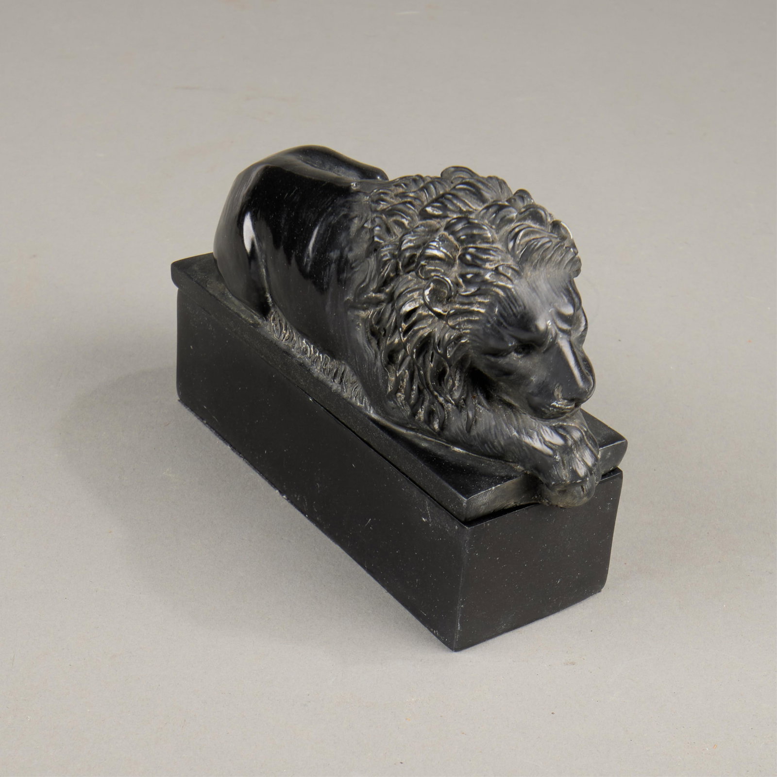 Box of a Lion Sleeping: Composite resin box with a lid with a recumbant or sleeping lion.Height: 4 3/4 in x width: 6 in x depth: 2 in.