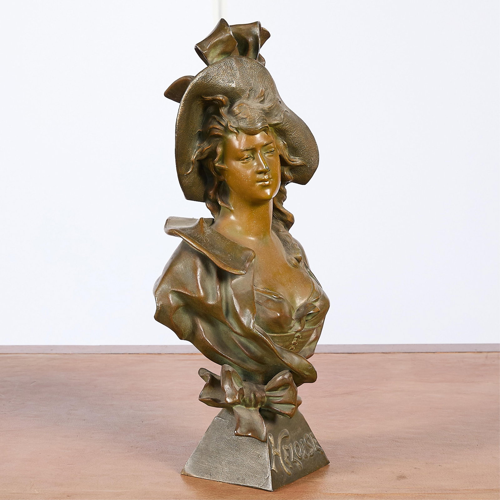 Antique Bronze "Heloise" Bust of Woman: Antique bronze bust of a woman, incised "Heloise" along the base.Height: 17 1/2 in x width: 9 in x depth: 5 1/2 in.