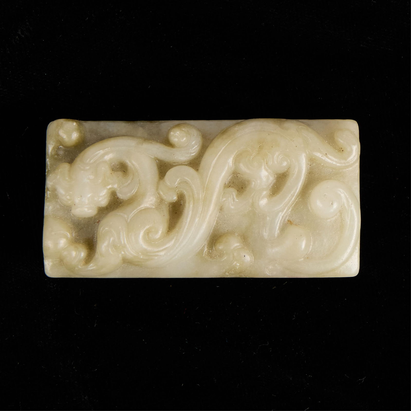 Chinese Modern Carved Jade Belt Slide: Modern Chinese carved jade belt slide with a dragon design.Height: 2 1/2 in x width: 1 in x depth: 1/2 in.