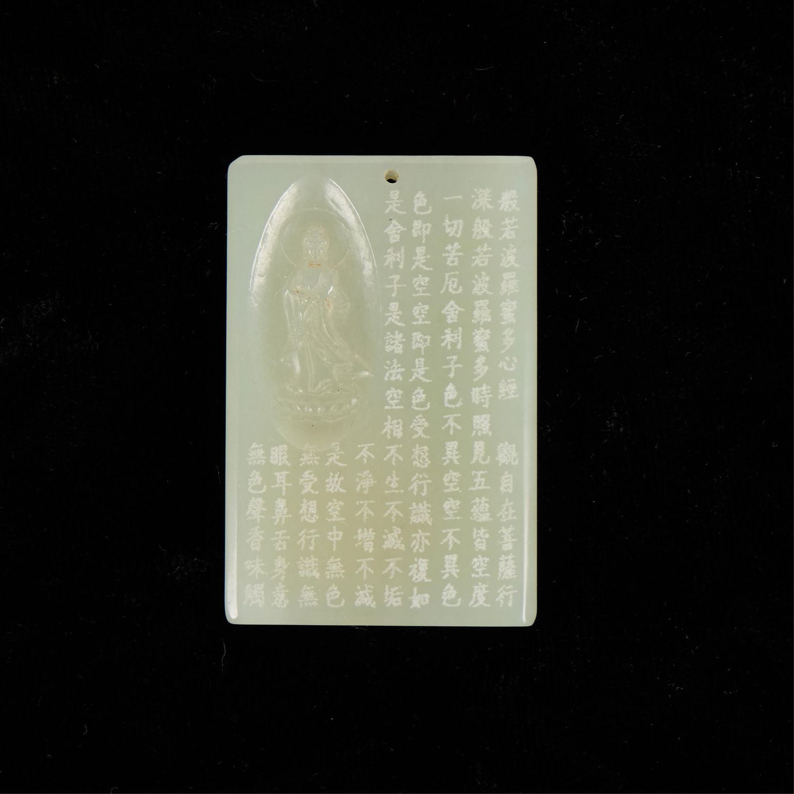 Chinese Modern Carved Jade Plaque: Chinese modern carved jade plaque. Depicting a Guanyin figure and numerous incised characters.Height: 2 1/4 in x width: 1 1/2 in x depth: 1/4 in.