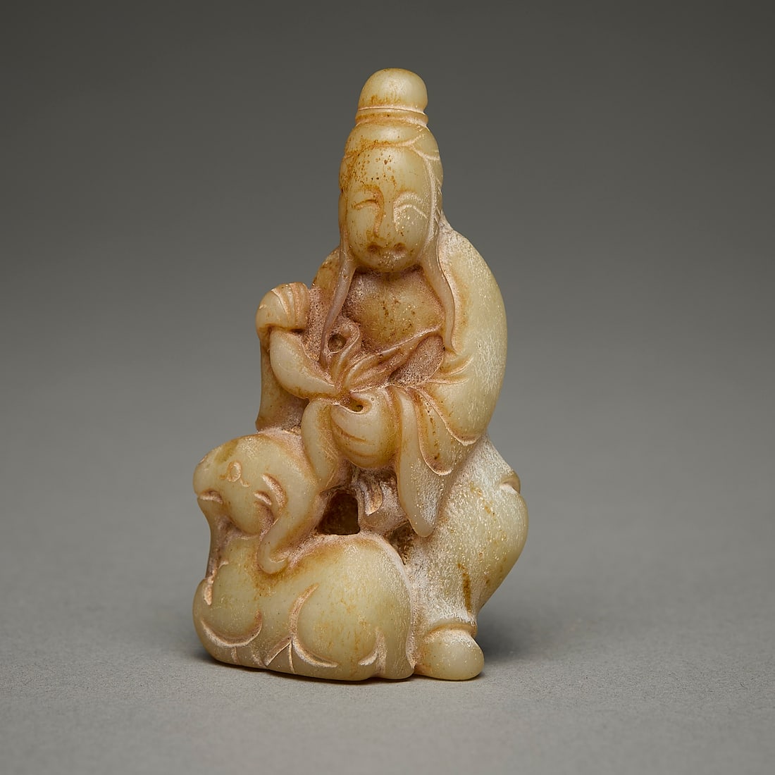 Chinese Carved Jade or Hardstone Figure w/ Goat: Chinese carved jade or hardstone figure with a goat kneeling beside them.Height: 3 in x width: 1 1/2 in x depth: 1 in.