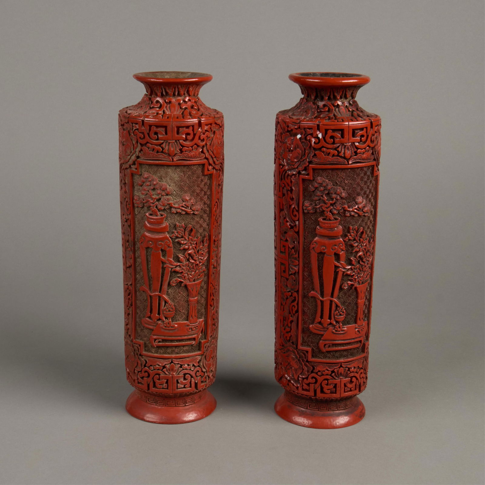 Pr Chinese Carved Red Lacquer Vases: Pr Chinese Carved wood red lacquer vases.(Each) height: 13 in x diameter: 4 in.
