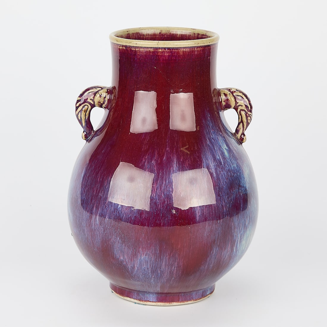 Large Chinese Qing Oxblood Porcelain Hu Vase: Large Chinese porcelain vase with "langyao" oxblood or sang-de-boeuf flambe red glaze, Qing Dynasty. Of rounded hu jar form, flanked by loop handles along either side of the neck.Height: 13 in x diame