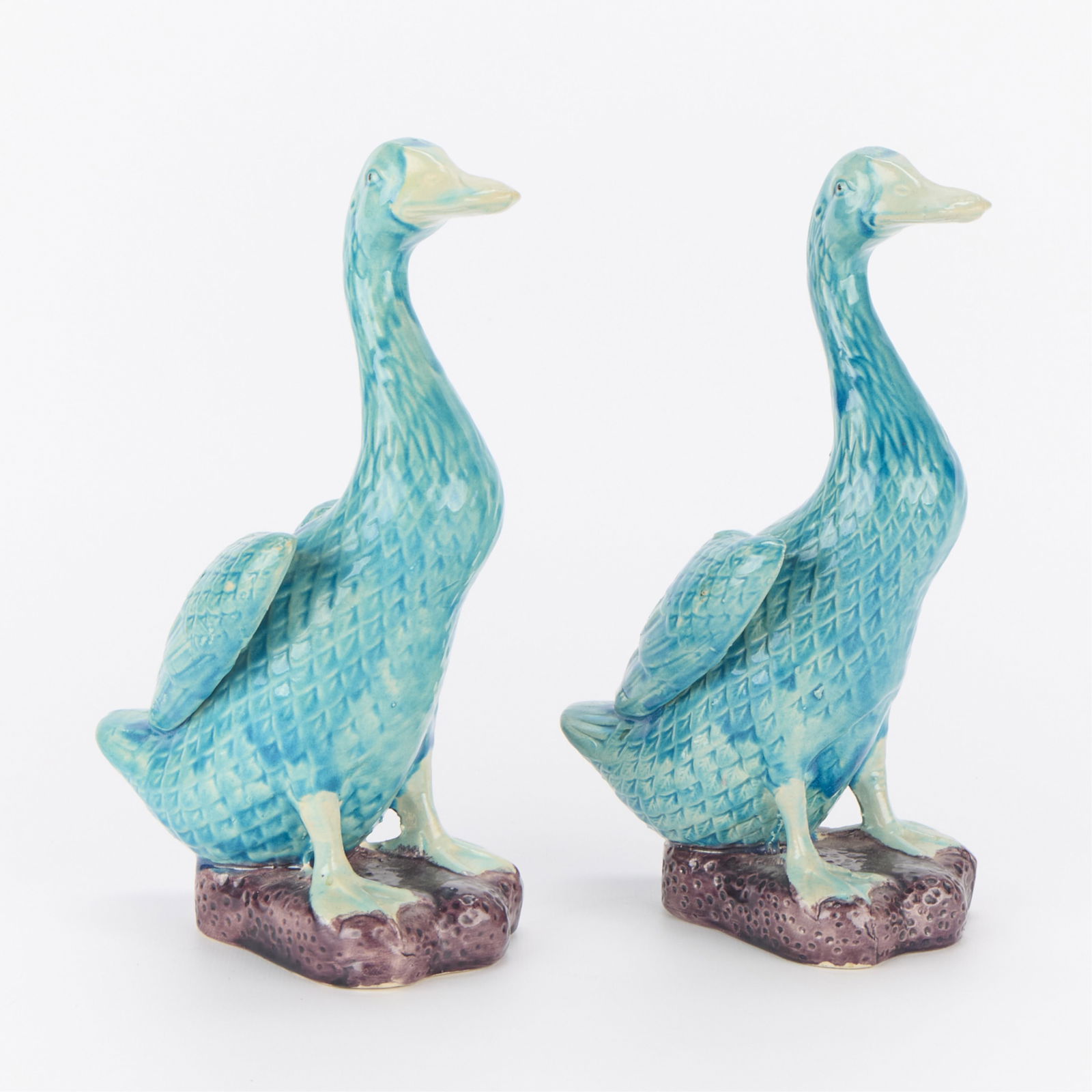 Pr Japanese Turquoise Porcelain Ducks: Pair of Japanese export porcelain duck figures with turquoise glaze.(Each, approximately) height: 8 in x width: 3 1/2 in x depth: 5 in.