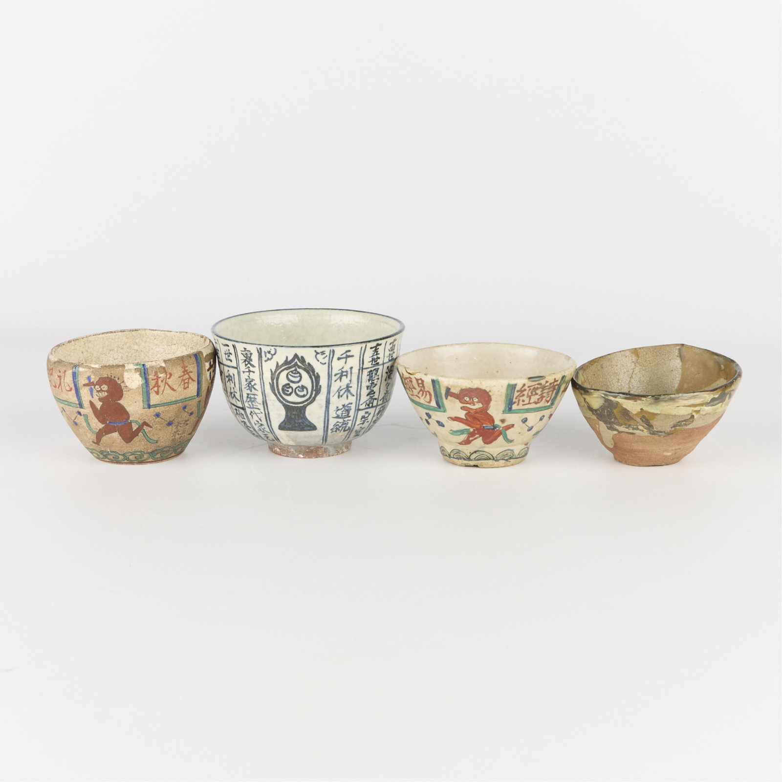 4 Japanese Studio Pottery Ceramic Chawan Teabowls: Group of four Japanese studio pottery ceramic or porcelain chawan teabowls.Height ranges from 2 1/4 in to 3 in; diameter ranges from 3 3/4 in to 4 1/2 in.