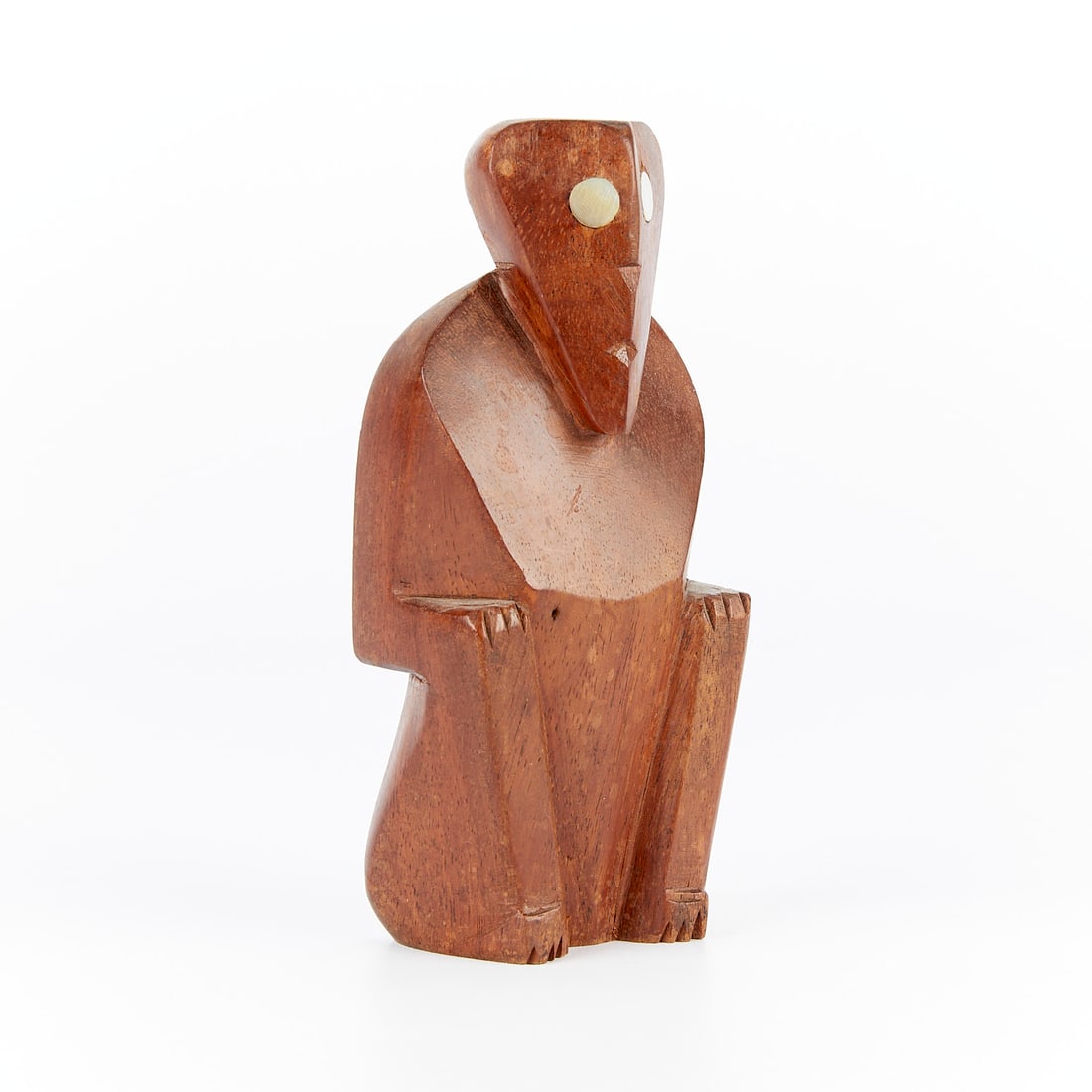 WWII Era Caroline Islands Seated Wooden Figure: Seated wooden figure from the Caroline Islands, Palau or Satawan, Micronesia, WWII-era. Height: 6 in x width: 2 3/4 in x depth: 1 3/4 in.