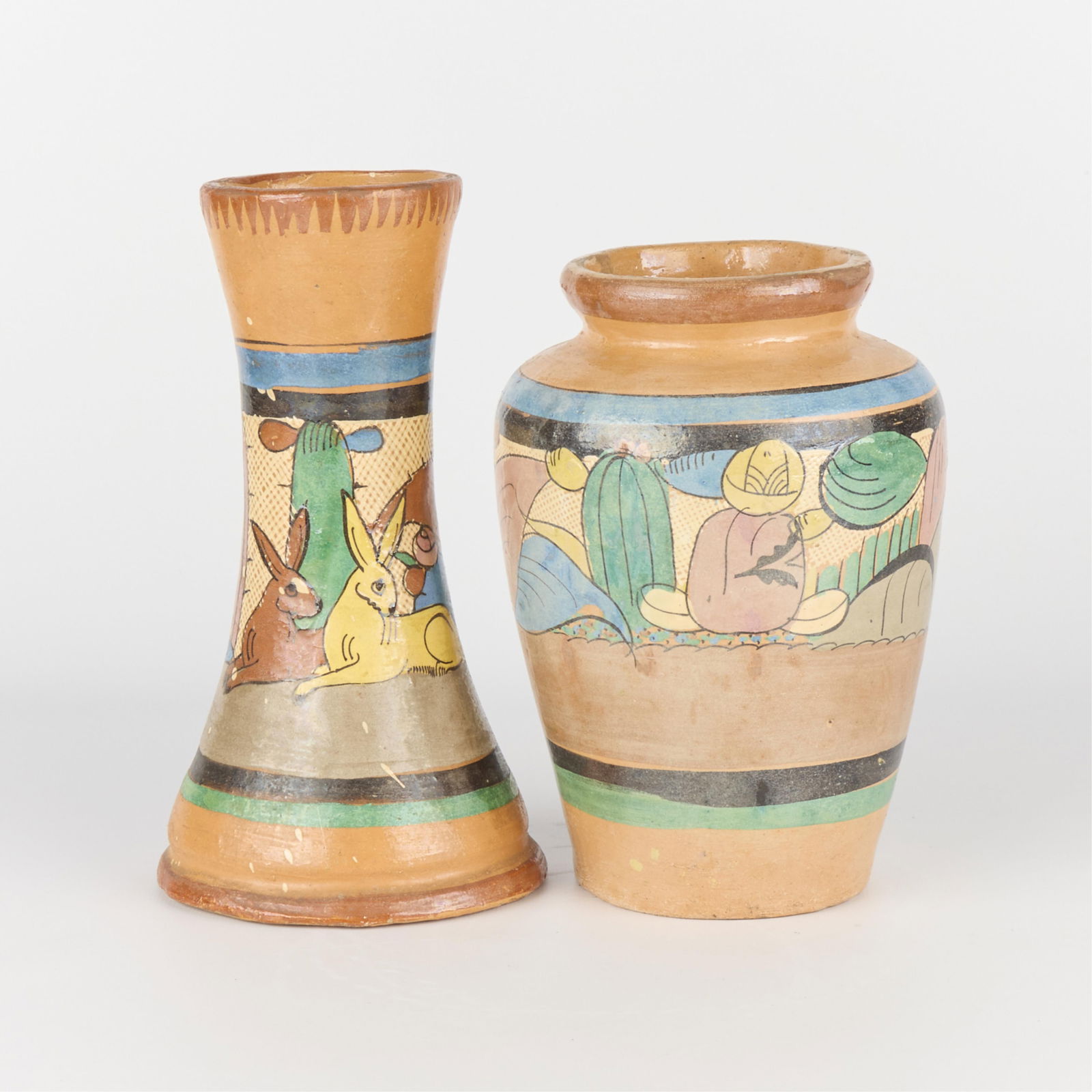 2 Mexican Folk Art Tlaquepaque Petatillo Pottery Vases: Group of two vintage Mexican folk art Tonala "Tlaquepaque" style Petatillo tourist pottery pictorial vases depicting pastoral scenes against cross-hatched ground, ca. 1940s-1950s.(Baluster) Height: 8