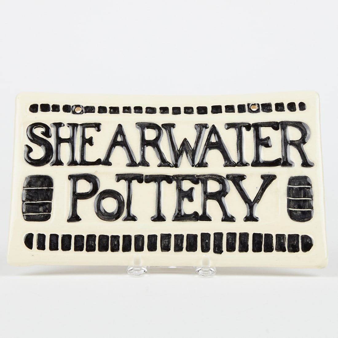 Shearwater Pottery Glazed Plaque Marked: Shearwater Pottery glazed plaque, 2010. Marked with a stamp along the verso, and incised with the date.Height: 5 1/2 in x width: 9 1/4 in x depth: 1/2 in.