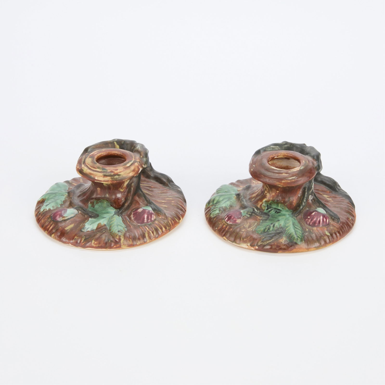 Pair Vintage Weller Pottery "Warwick" Candlesticks: Pair of vintage art pottery Weller Ware "Warwick" line candlestick holders with applied loop handles, ca. 1920s. Featuring an arboreal pine tree motif with matte brown and green glazes. Both stamped "