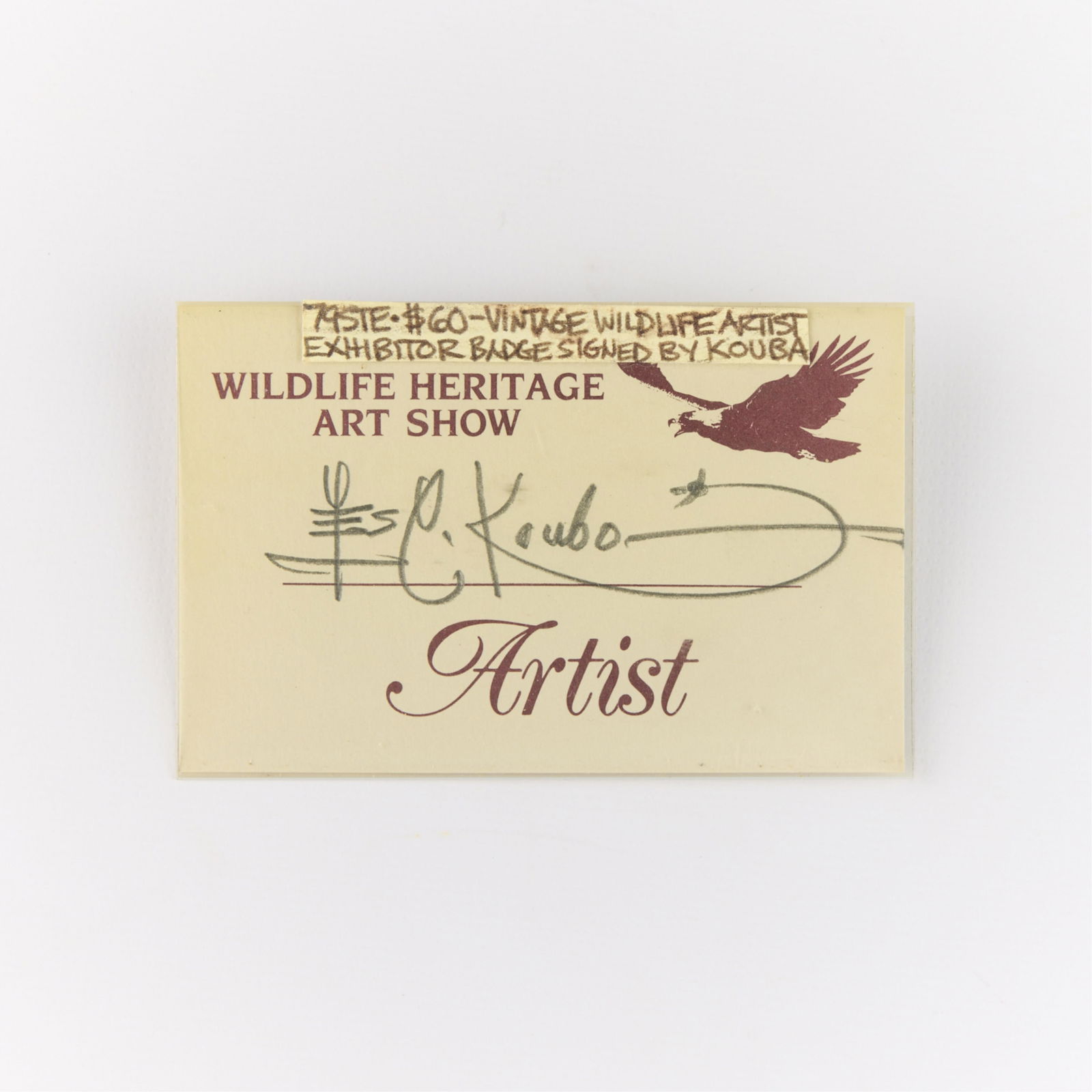 Les Kouba Signed Wildlife Heritage Art Show Badge: Leslie (Les) C. Kouba (American, 1917-1998). Signed artist exhibitor badge for the Wildlife Heritage Art Show, ca. 20th century. Height: 2 1/4 in x width: 3 1/2 in.