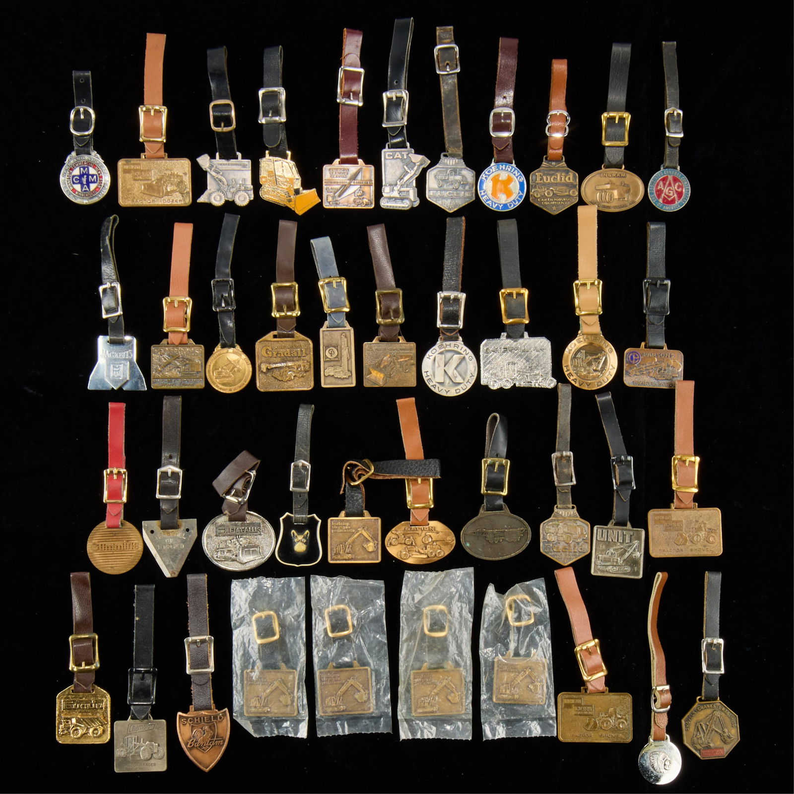 Group Assorted Vintage Watch Fobs: Large group of assorted vintage watch fobs. (Shipping dimensions) Height: 6 in x width: 6 in x depth: 6 in.