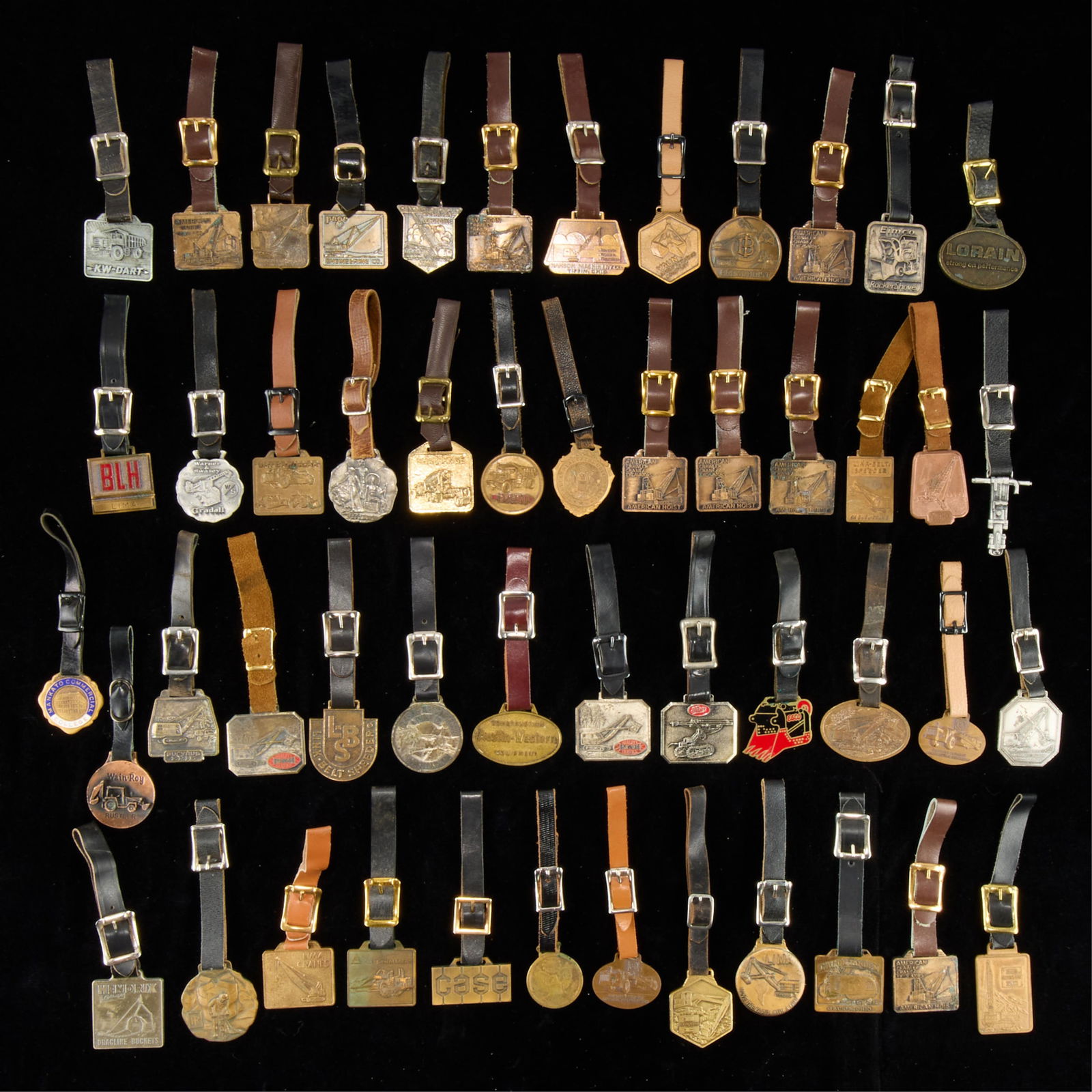 Group of Watch Fobs: Large group of assorted vintage watch fobs. (Shipping) height: 6 in x width: 6 in x depth: 6 in.