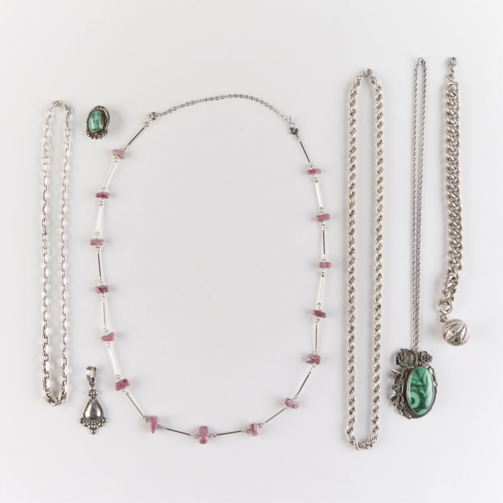 7 Pcs Sterling & Silver Jewelry: Including: one sterling silver and malachite pendant with a sterling chain; one malachite and silver pin or brooch - unmarked; one Mexican sterling silver pendant; one sterling silver chain; one