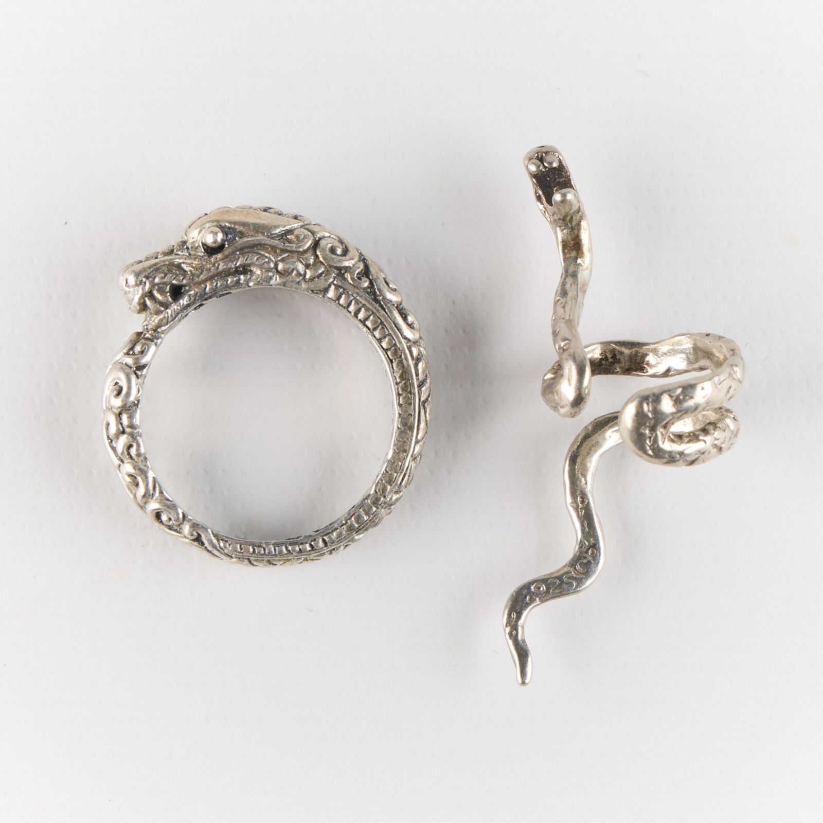 Sterling Silver Snake Ring & Ear Cuff: Including one 925 sterling ring and one 925 sterling ear cuff. Each in the form of snakes. Both marked. (Ring) Size: 8 1/2 US. (Ear Cuff) Diameter: 1/2 in.