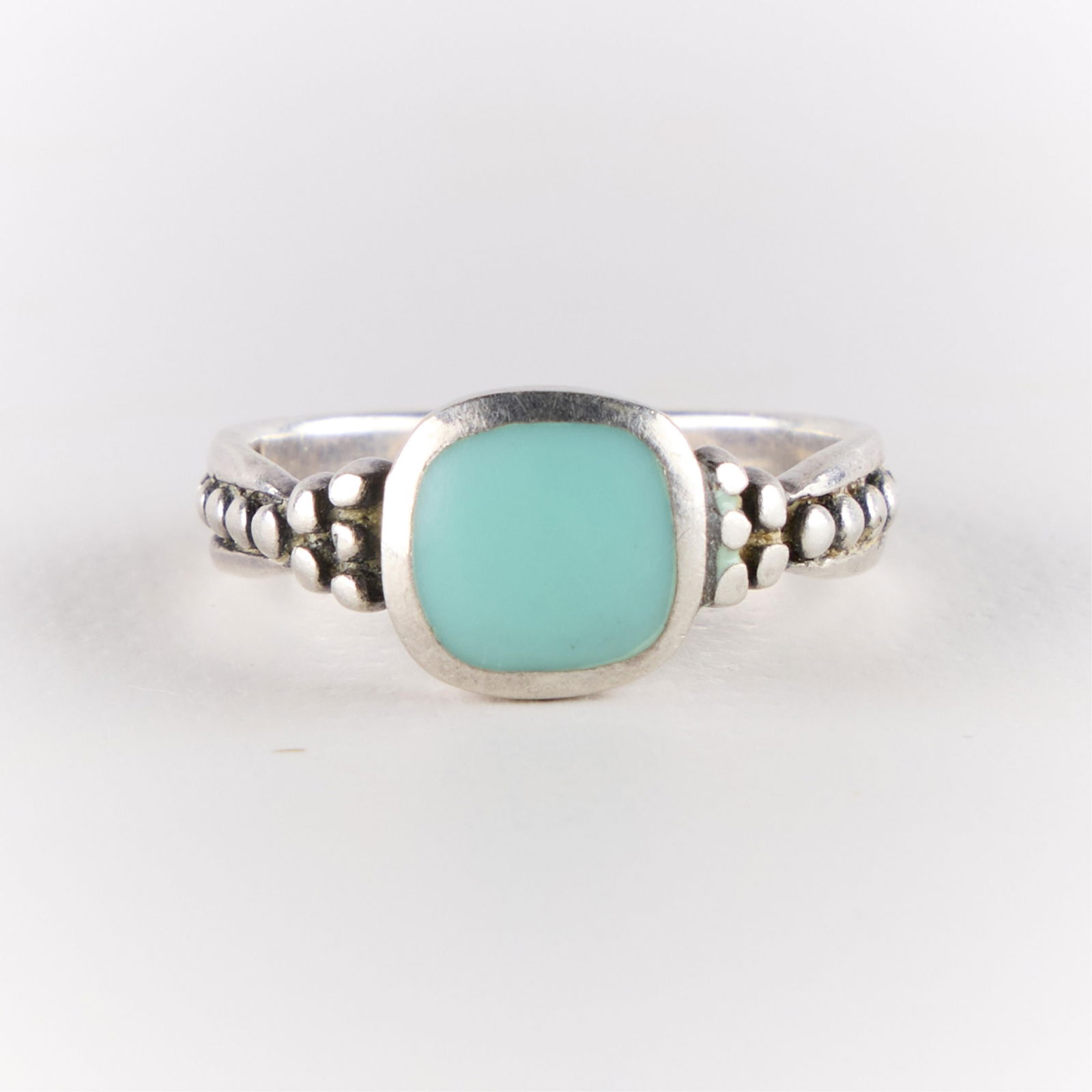 Vintage Boho Sterling Silver Ring: Vintage boho-style sterling silver ring with inlaid light blue stone, possibly turquoise. Marked. Ring size: 6 3/4 US. Weight: 2.88 g.