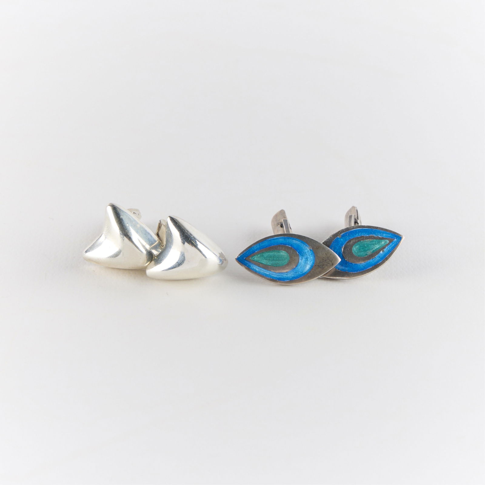 2 Pairs Modernist Sterling Cufflinks: Including one pair of sterling silver earrings with modernist blue and green enamel design, and one pair sterling silver earrings of abstract form. Marked. Gross weight: 20.17 g.