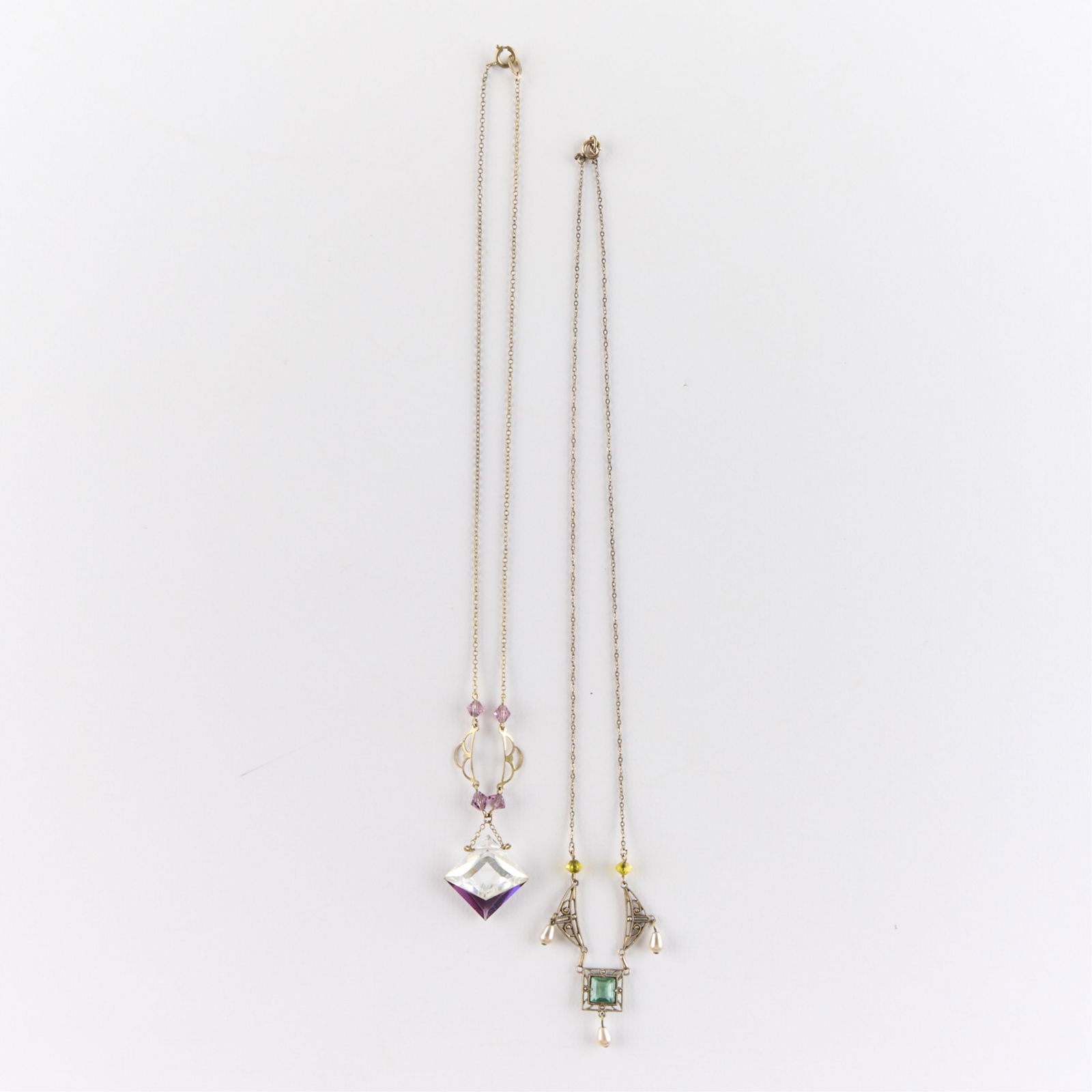 2 Costume Necklaces: Two costume necklaces of swag form. Length ranges from 16 in to 19 1/2 in. Gross weight: 9.6 g.