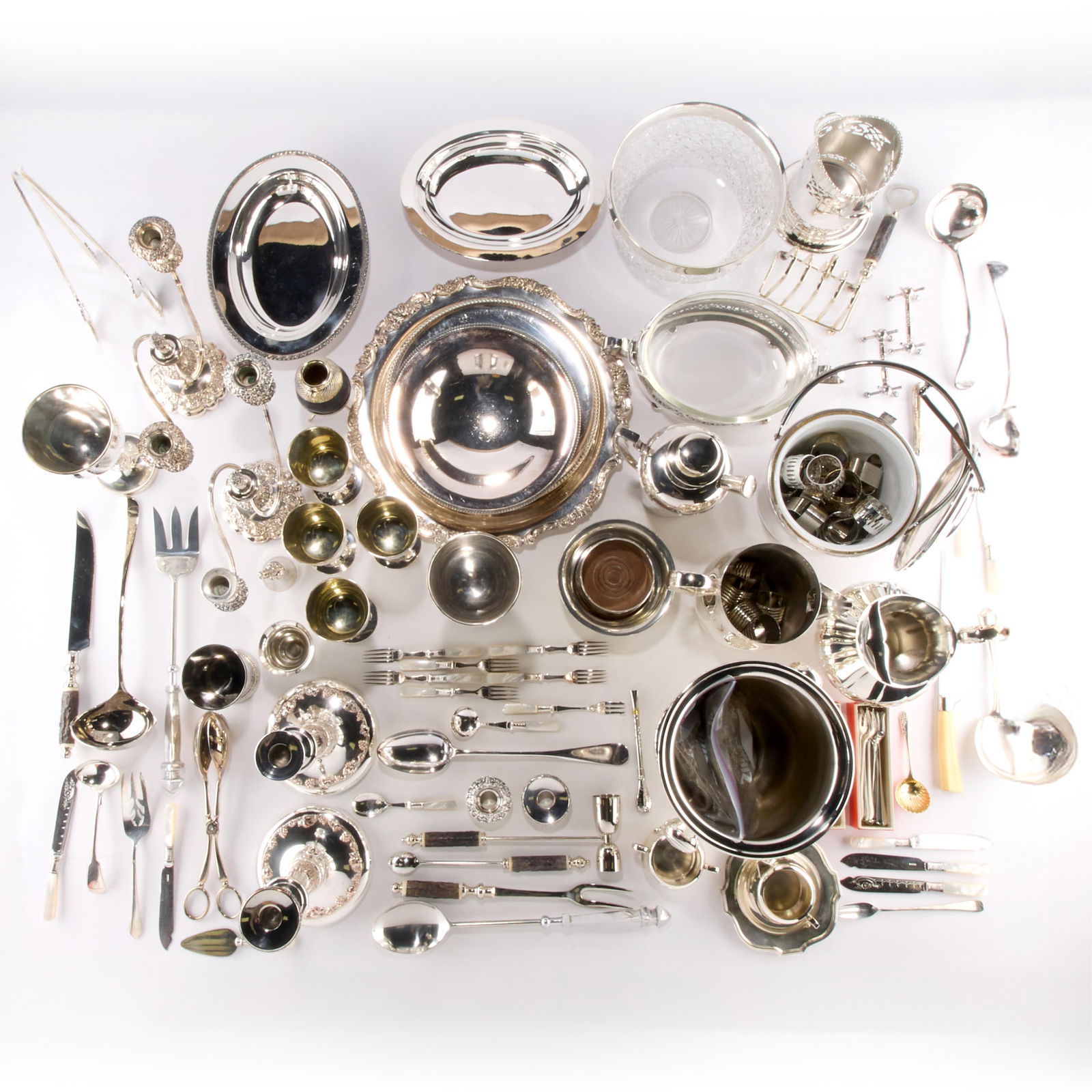 Approx. 54 lbs Misc. Silverplate Serving & Dining Utensils: Large group of assorted or miscellaneous silver plate flatware, dinnerware, servingware, yerba mate cup, footed pedestal bowl, two platters, a candlestick, and other dining utensils. Including pieces