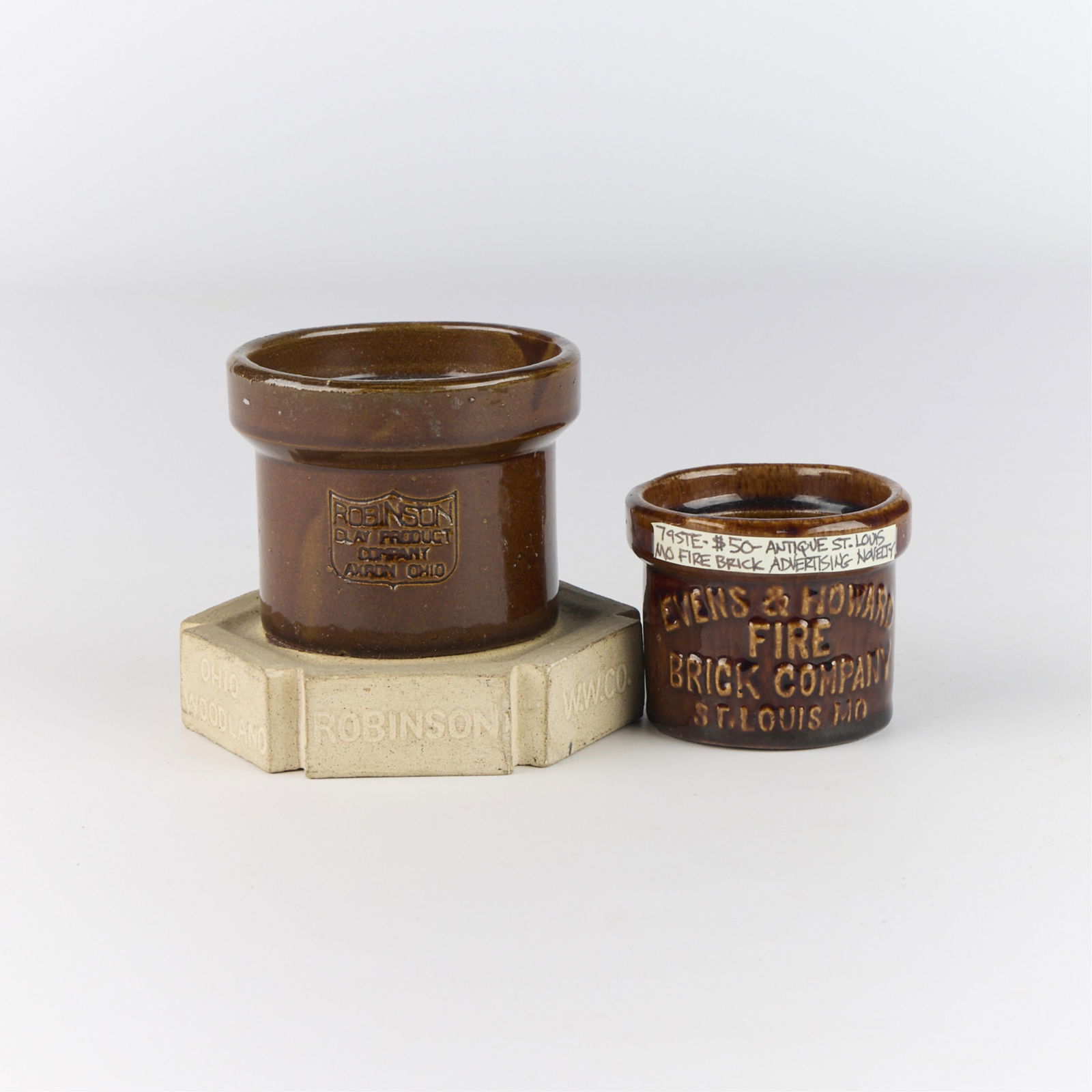 2 Antique Ceramic Advertising Crocks: Including: One Robinson Clay Product Company, Ohio, ceramic advertising crock in the form of a sewer pipe; one Evens & Howard Fire Brick Company, Missouri, rounded advertising ceramic crock.(Smaller)