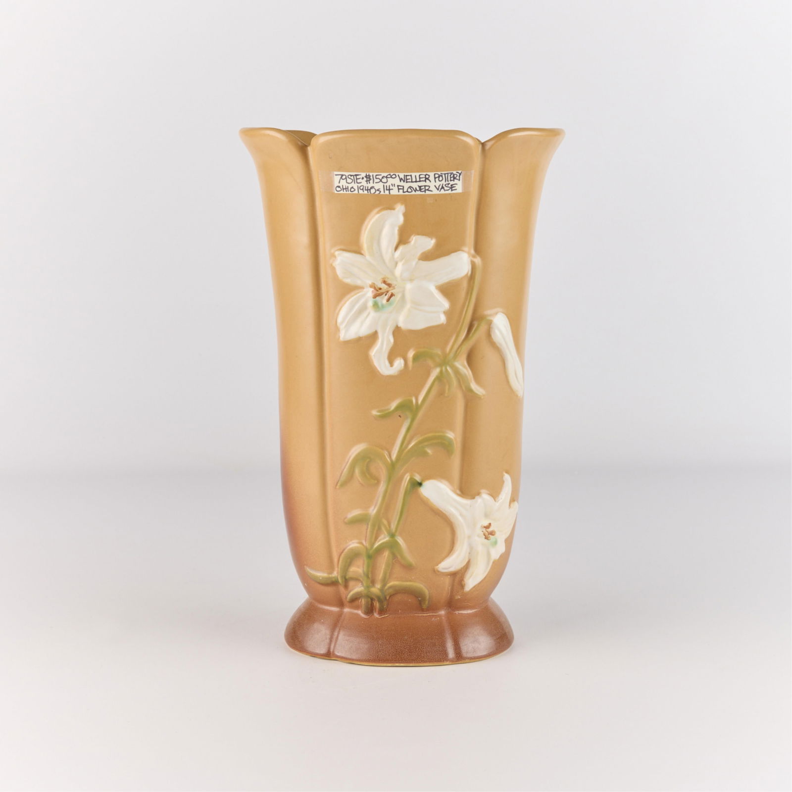 Weller Art Pottery "Lilies" Ceramic Floral Vase: Weller Pottery ceramic vase depicting white Madonna lilies in bloom. Of elongated form featuring a scalloped rim and distinctive ombre glaze. Marked.Height: 13 in x width: 8 in x depth: 7 in.