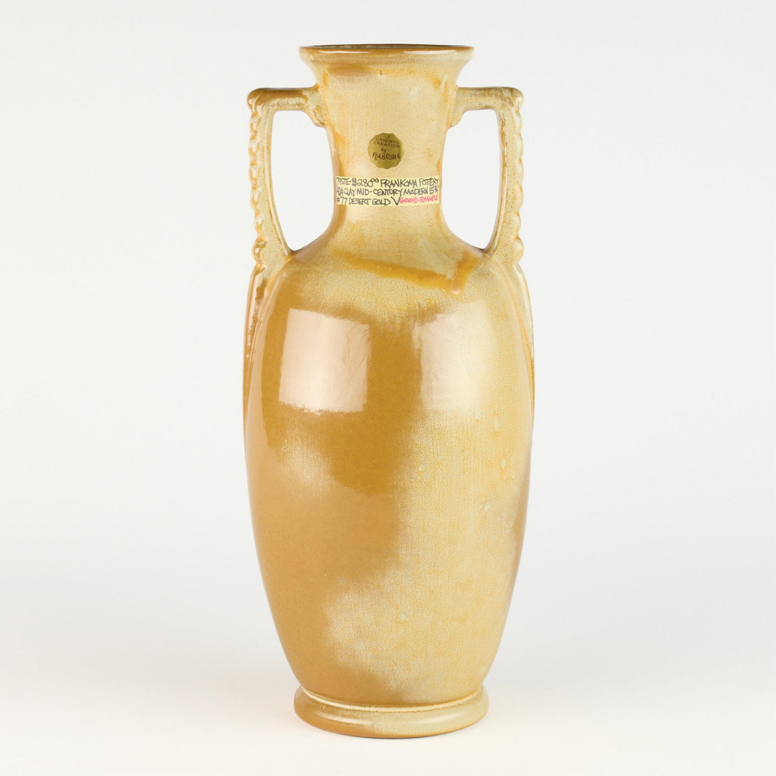 Frankoma Pottery MCM Ada Clay Desert Gold Vase Amphora: Frankoma Pottery, United States. Mid-century modern art pottery Ada clay two-handled vase or amphora. With "Desert Gold" glaze. Marked along the underside and with a sticker along the neck.Height: 15