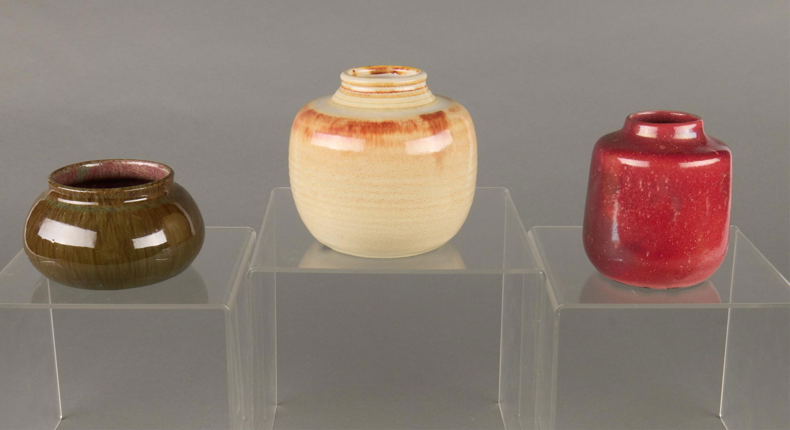 3 MCM Dutch Netherlands Studio Pottery Vases: Group of three mid-century modern Dutch ceramic art pottery vases. Including one Zaalberg Holland vase executed in a red glaze, one Mobach Utrecht vase executed in a cream flambe glaze, and one mottle