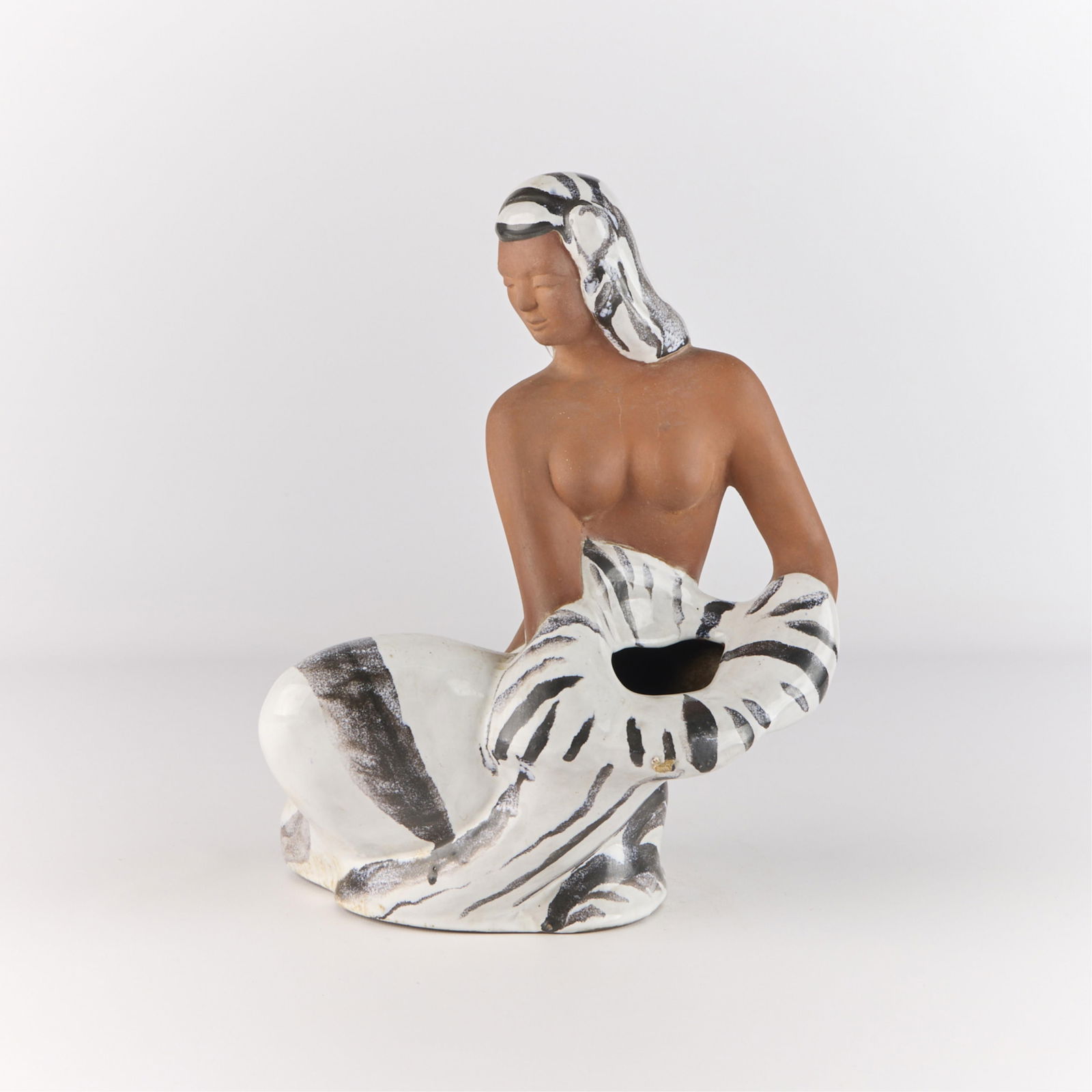 Mary Erckenbrack Ceramic Figural Planter Vase: Mary Erckenbrack (American, 1910-1992). Studio ceramic figural vase or planter in the form of a partially nude woman, possibly of Polynesian descent, dressed in striped or zebra print clothing, ca. 19