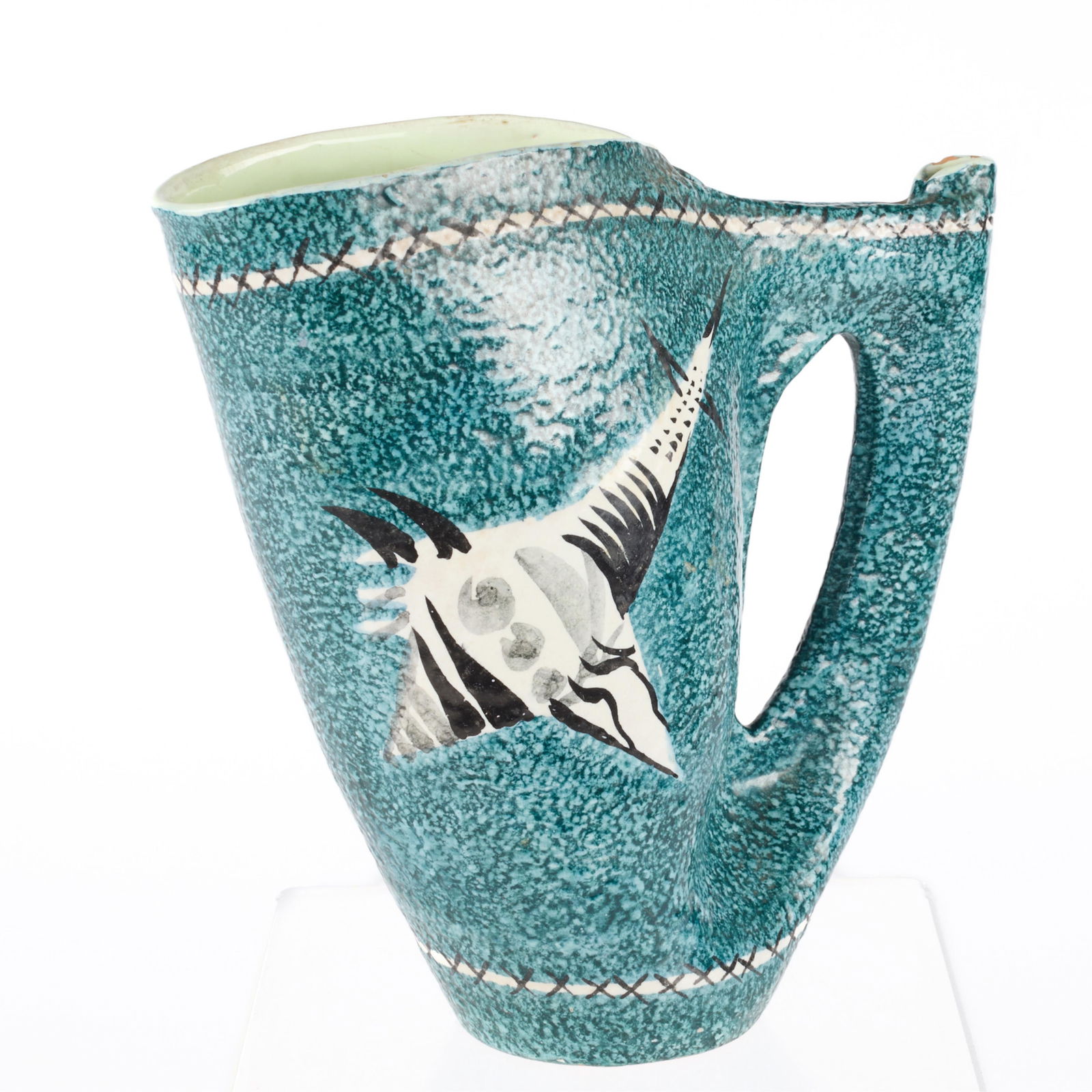 Rare Ed Langbein MCM Italian Ceramic Pitcher: Ed Langbein (American, 20th century). Rare Italian mid-century modern art pottery pitcher. Depicting an abstract fish or stingray motif. Executed in black and white glaze on speckled blue ground.