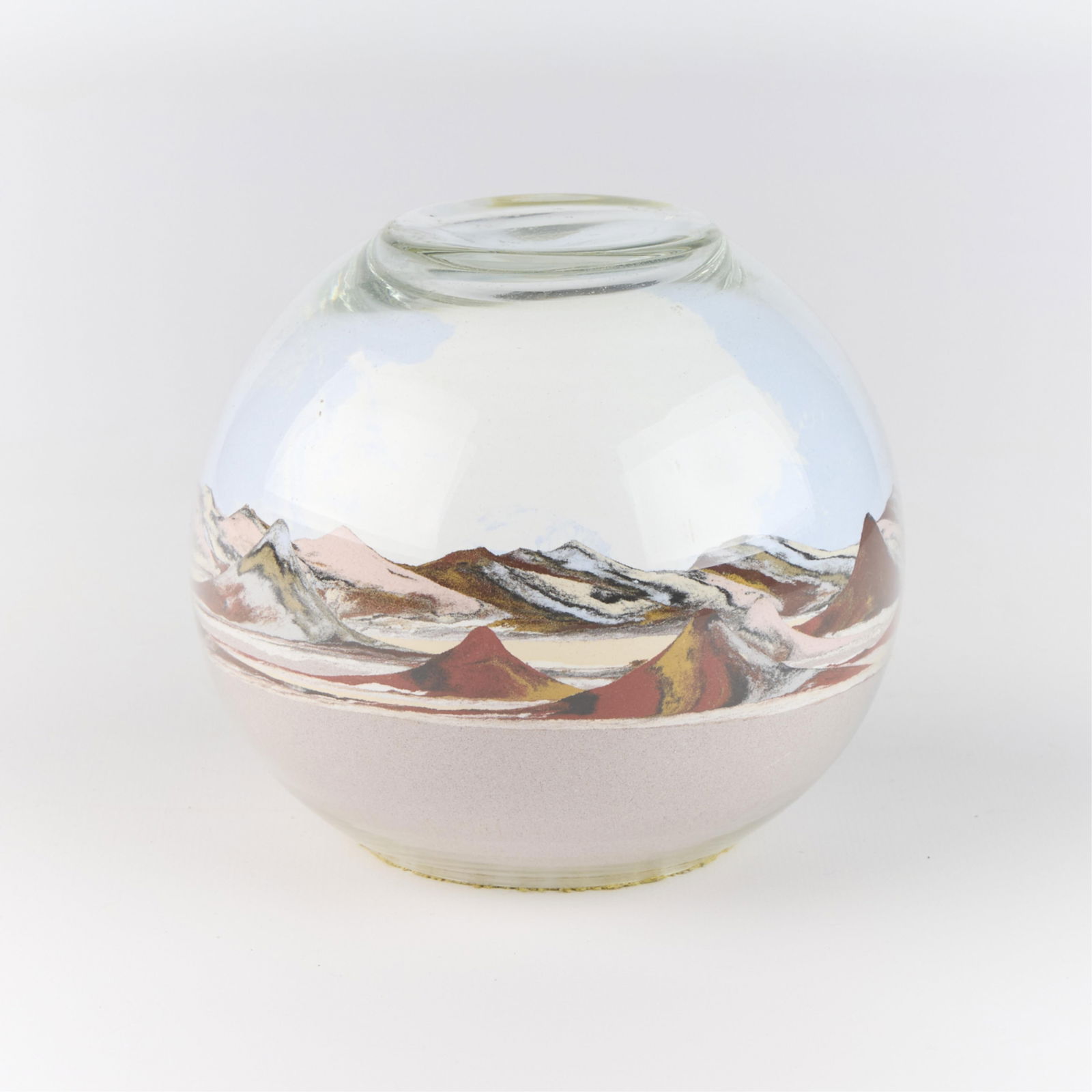 Large Sand Art Southwest Scene Glass Paperweight: Large and skillfully layered sand art globe glass paperweight. Depicting a Southwestern landscape.Height: 4 1/4 in x diameter: 4 1/2 in.