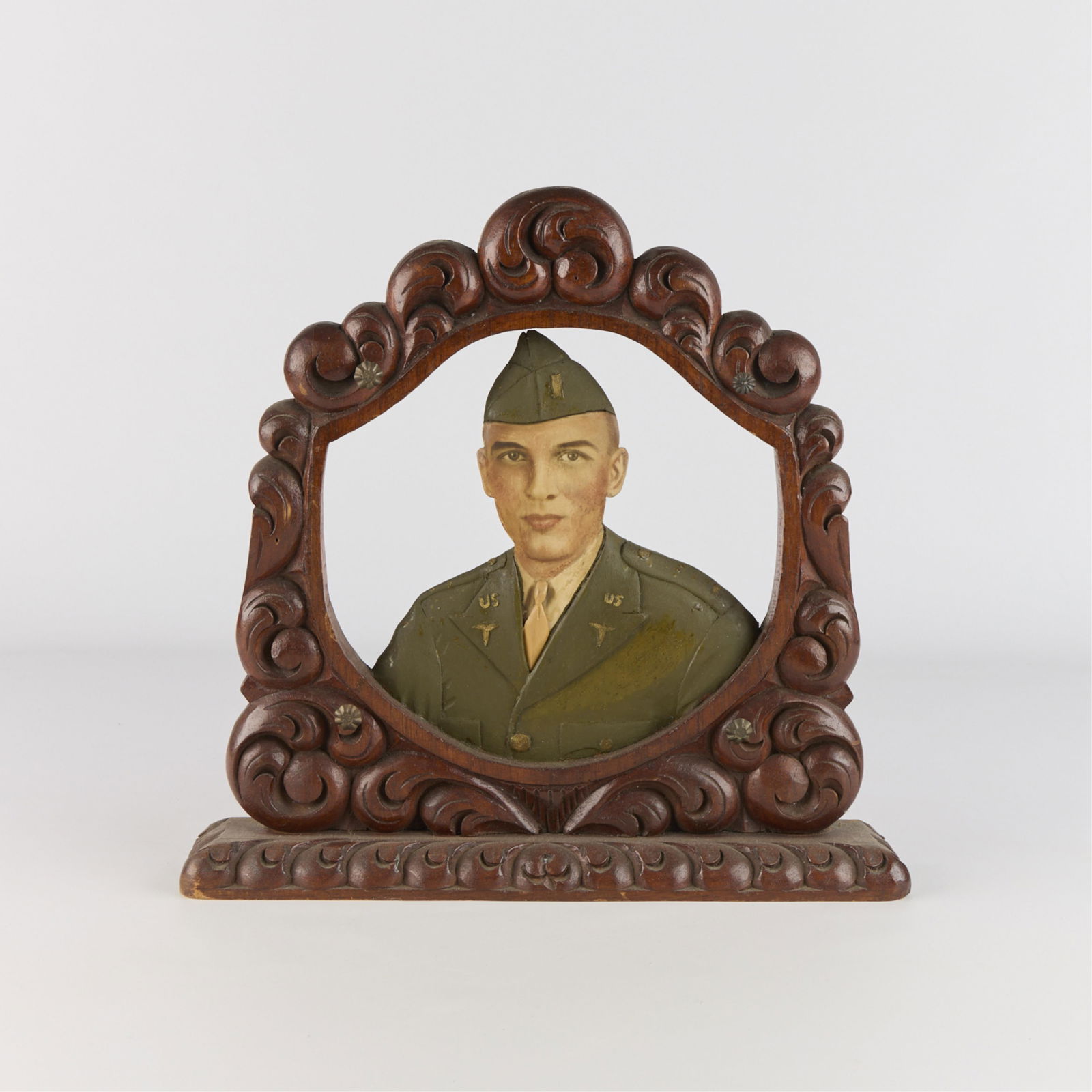 Lrg WWII Era U.S. Soldier Portrait w/ Carved Wooden Frame: Large antique World War II-era carved and polychrome pigment on wood portrait depicting a United States soldier, possibly a medical corps officer, with carved wooden frame, ca. 1940s.Height: 14 in x w